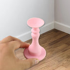 Flexible pink washing machine door stopper protecting washer gasket