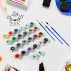 An adult enjoying the mindful process of painting by numbers with the 24-color kit.