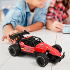 Red RC race car showing action shot on rough terrain for kids