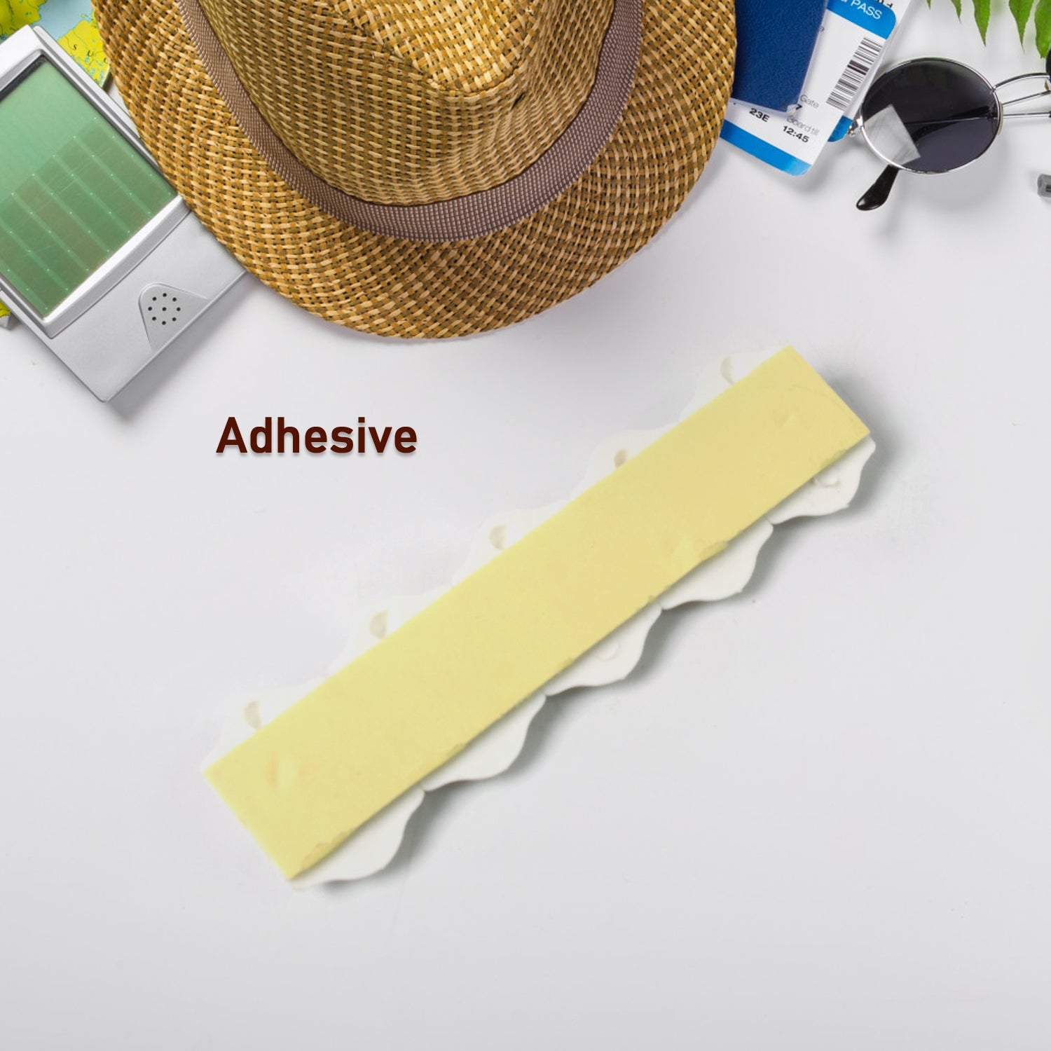 Adhesive wall hooks applied in a bathroom to hang towels and bath accessories.