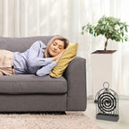 Mosquito coil holder with smoke gently rising from the repellent coil.