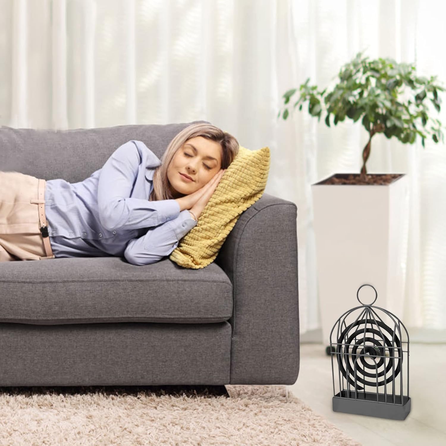 Mosquito coil holder with smoke gently rising from the repellent coil.