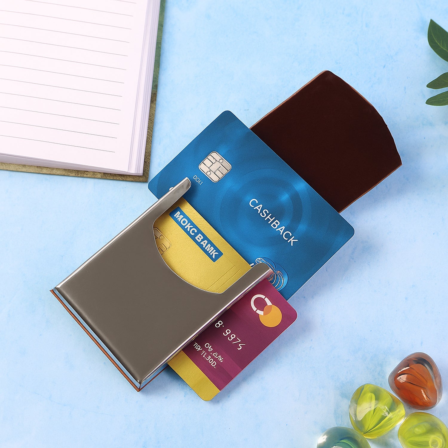 Compact business card holder wallet featuring a leather finish