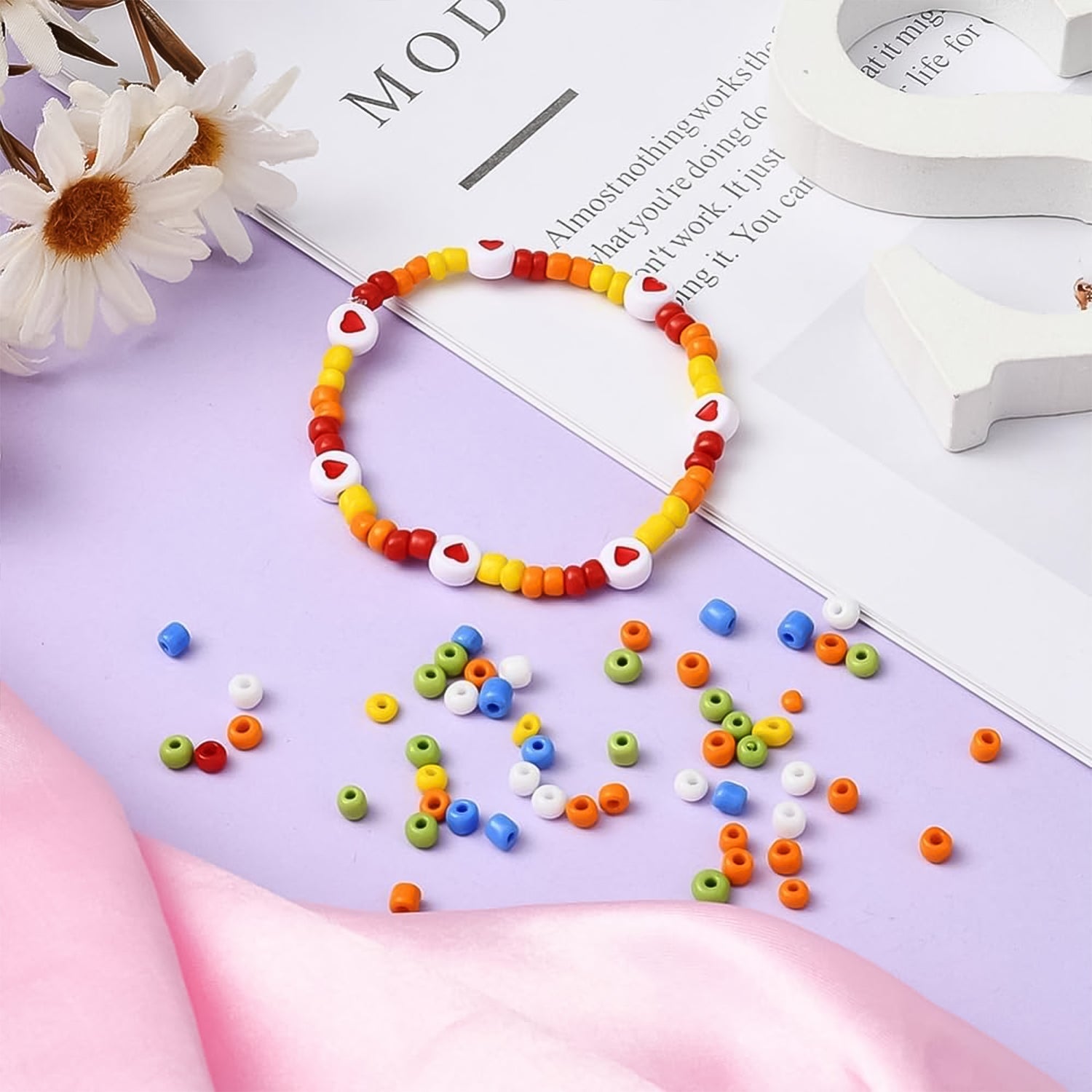 Essential components of the DIY bracelet kit: elastic string, clasps, and mini cutter