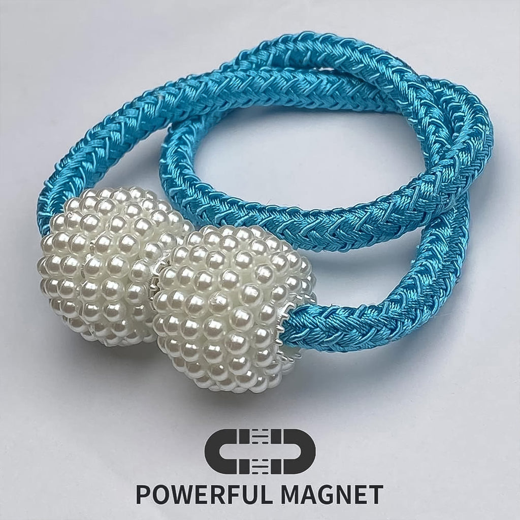 Hand holding magnetic curtain tieback demonstrating size and ease of use