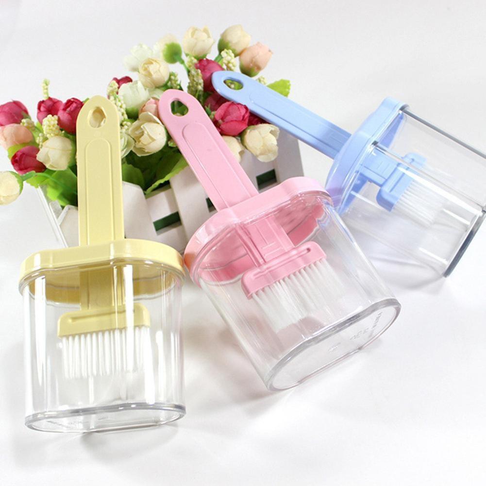 Hand holding the multipurpose plastic spatula with holder during cooking.
