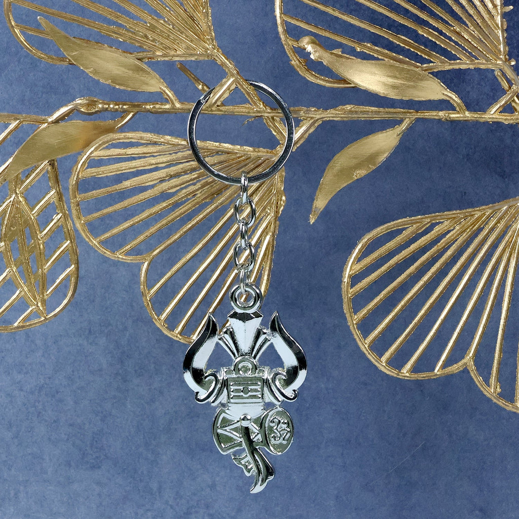 Side angle view of silver Trishul Damru keychain highlighting craftsmanship