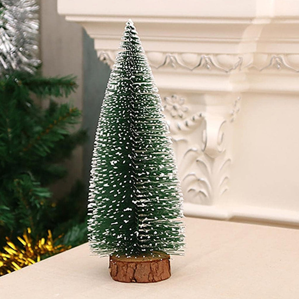 Miniature Christmas tree with snow-covered branches ideal for festive office decoration