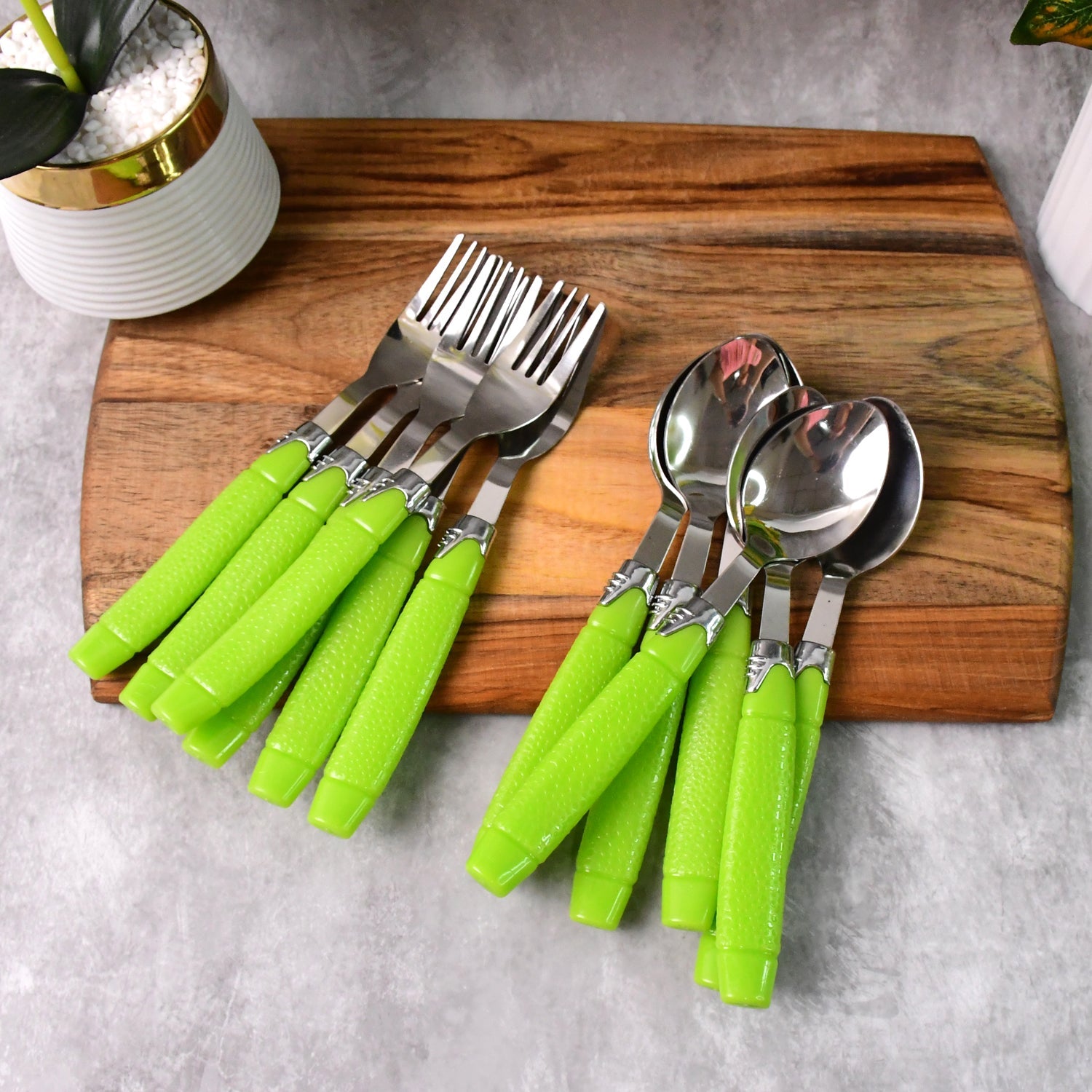 Assorted stainless steel spoons and forks from the 24-piece cutlery set