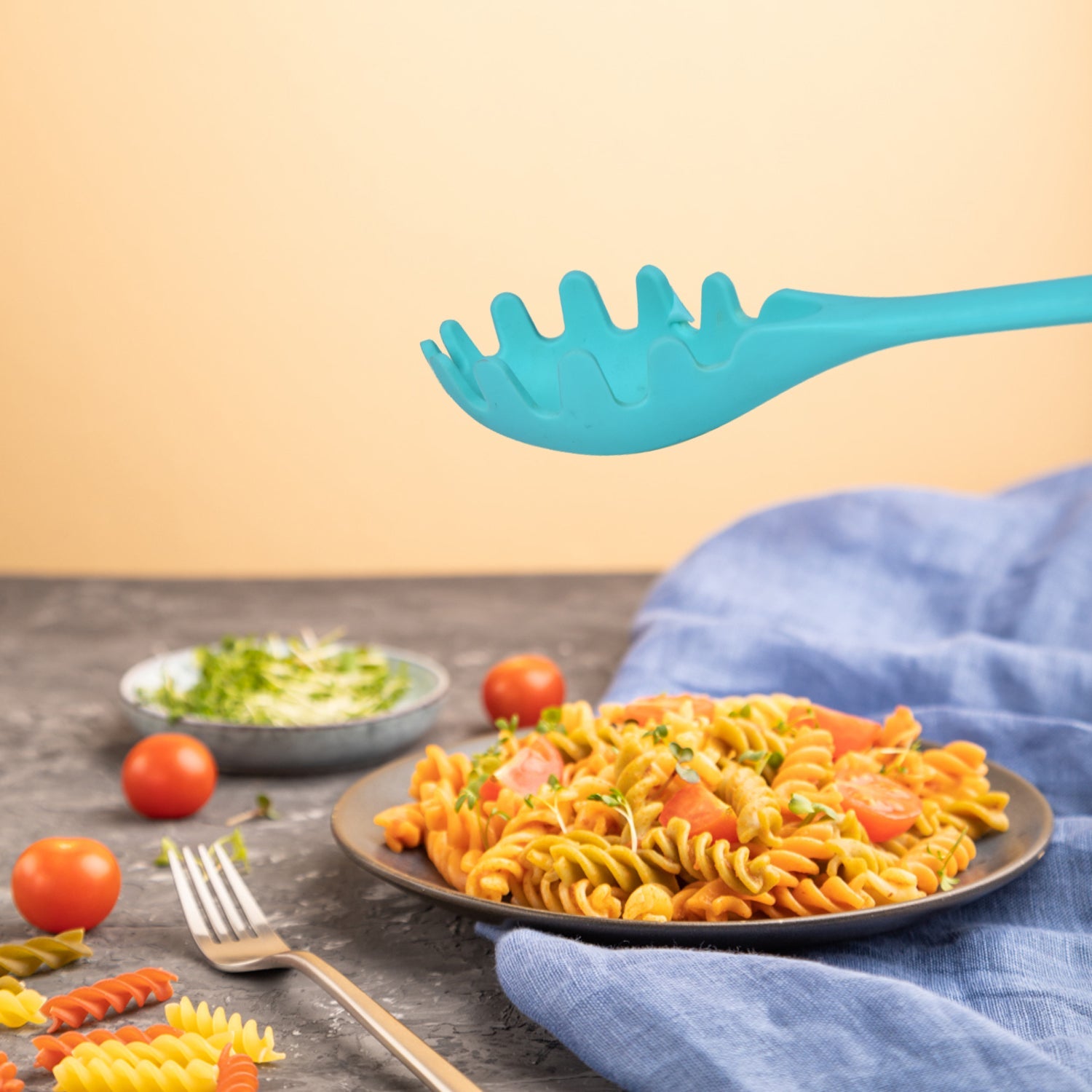 Close-up of the non-slip handle on the durable spaghetti serving fork.