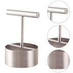 Fruit corer lying on a kitchen counter, highlighting its sleek design.