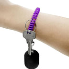 Detailed view of the spiral design of a telephone wire hair tie.