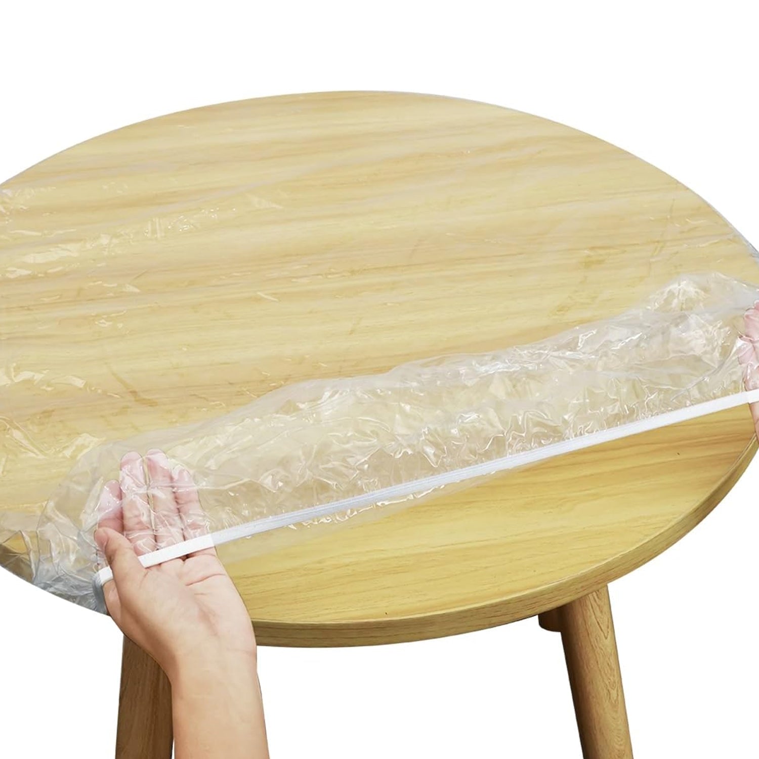 Side view showing the seamless fit of the elastic table protector on a table.