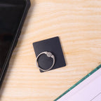 Close-up of the durable ring and strong adhesive base of the phone ring stand.