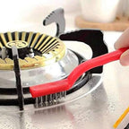 Top-down view of the ergonomic handle and angled head of the stainless steel brush.