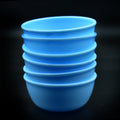 Set of 6 unbreakable plastic bowls in vibrant colors, ideal for everyday kitchen use.