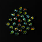 Glass marbles displayed with colorful swirl designs, ideal for kids and crafts