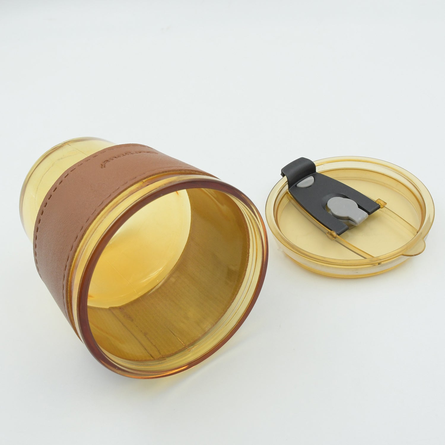 Modern design glass coffee mug with a secure lid and straw for easy sipping.