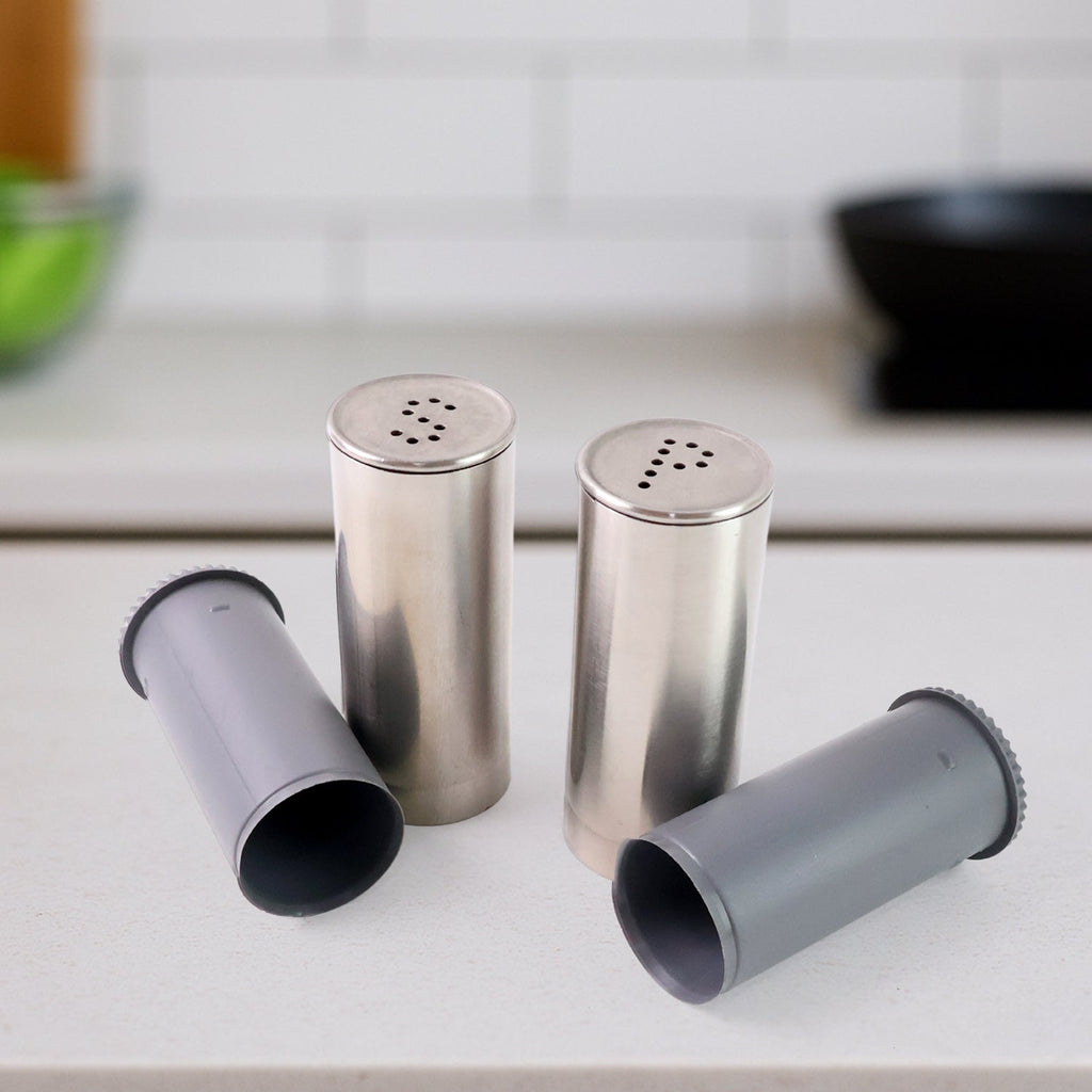 Modern style stainless steel salt and pepper shaker set in kitchen