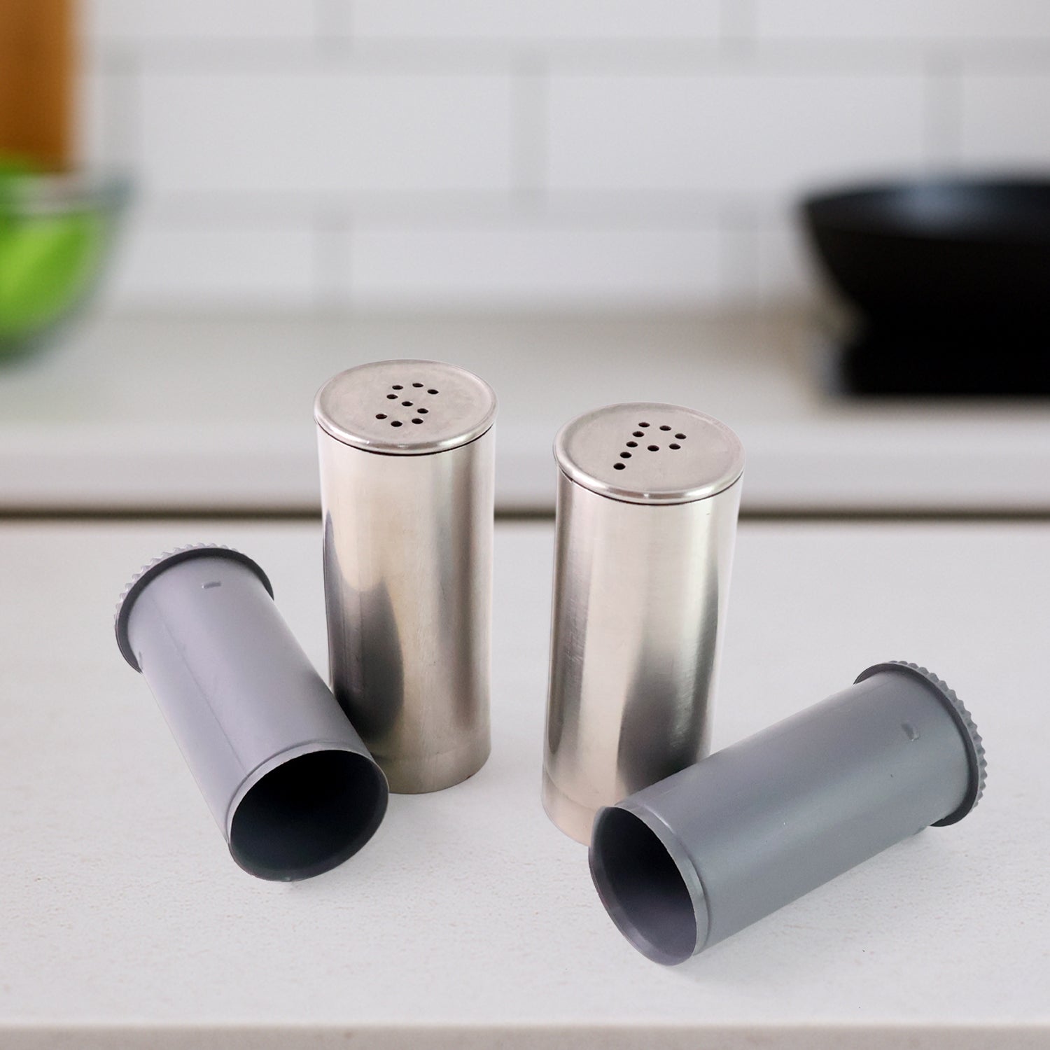 Modern style stainless steel salt and pepper shaker set in kitchen