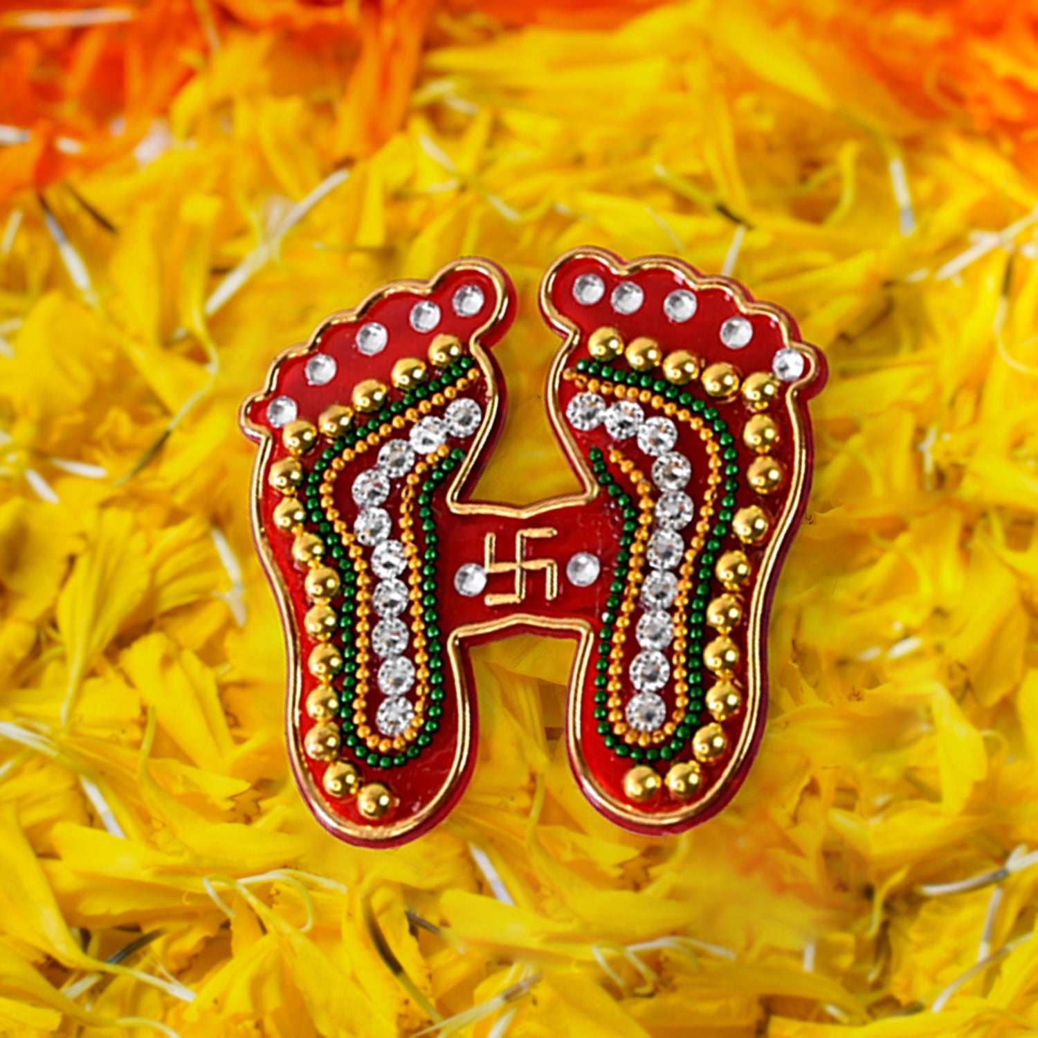 Detailed view of divine footprints sticker with multicolored beads and stones