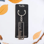 Metal keychain with Gujarati script and sturdy ring