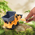A young boy focused on building his DIY construction set vehicle.