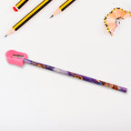 A child's hand holding the cartoon-themed school stationery set.