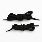 Several colourful polyester shoelaces laid out flat, highlighting the mixed color options.