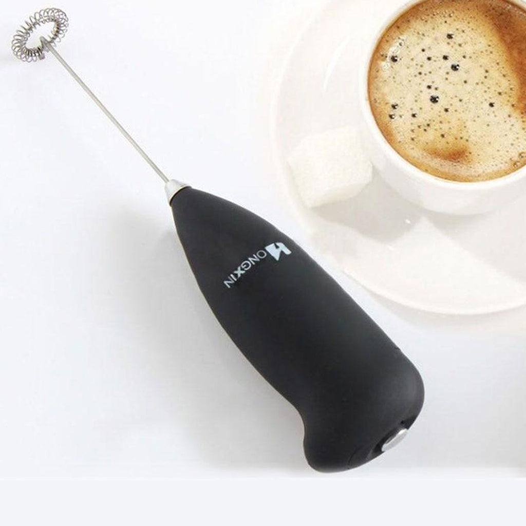 Lifestyle shot of the XcelCraft hand blender being used to prepare a healthy smoothie.