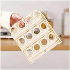 Hand opening the upper layer of the foldable egg tray to access eggs.