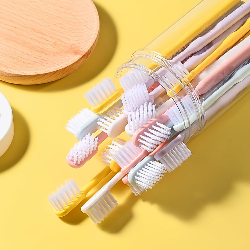 Single soft plastic toothbrush held, demonstrating its comfortable grip and flexible design.