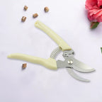 Stainless steel pruning shears from a side view, highlighting the design.
