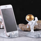 Astronaut Phone Holder as a fun desktop ornament without a phone, highlighting its whimsical design.