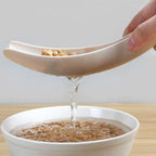 Detail of the rice sieve's fine mesh for effective straining of water.