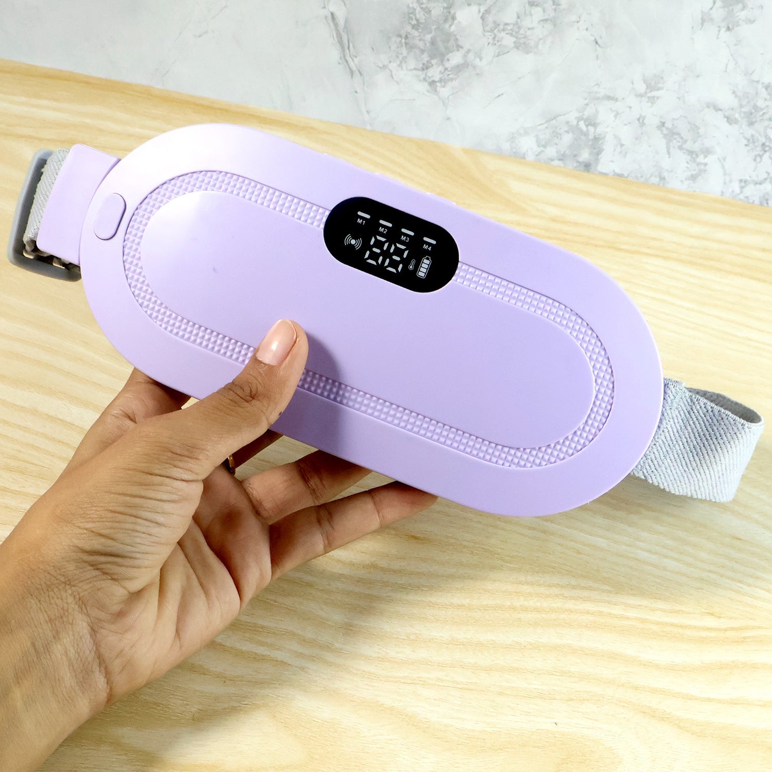 Side view of the portable Menstrual Cramp Relief Belt, showcasing its slim profile.