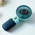 Rechargeable mini handheld fan with stable base for tabletop use