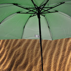 Ergonomic handle and sturdy frame of the windproof travel umbrella.