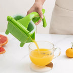 Close-up of the durable Teflon-coated manual juice squeezer.