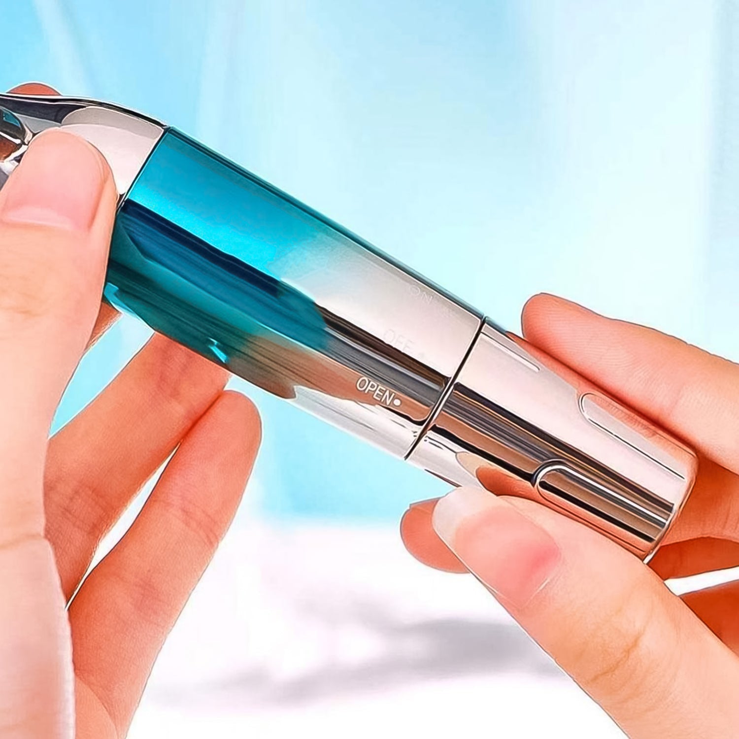Woman demonstrating the use of the face vibratory massager on her cheek.