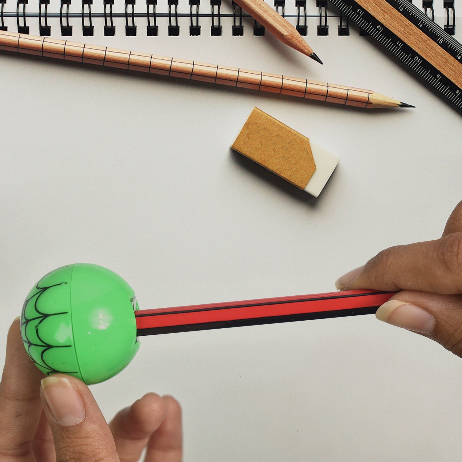 Close-up of a circular manual pencil sharpener, easy for small hands to grip.