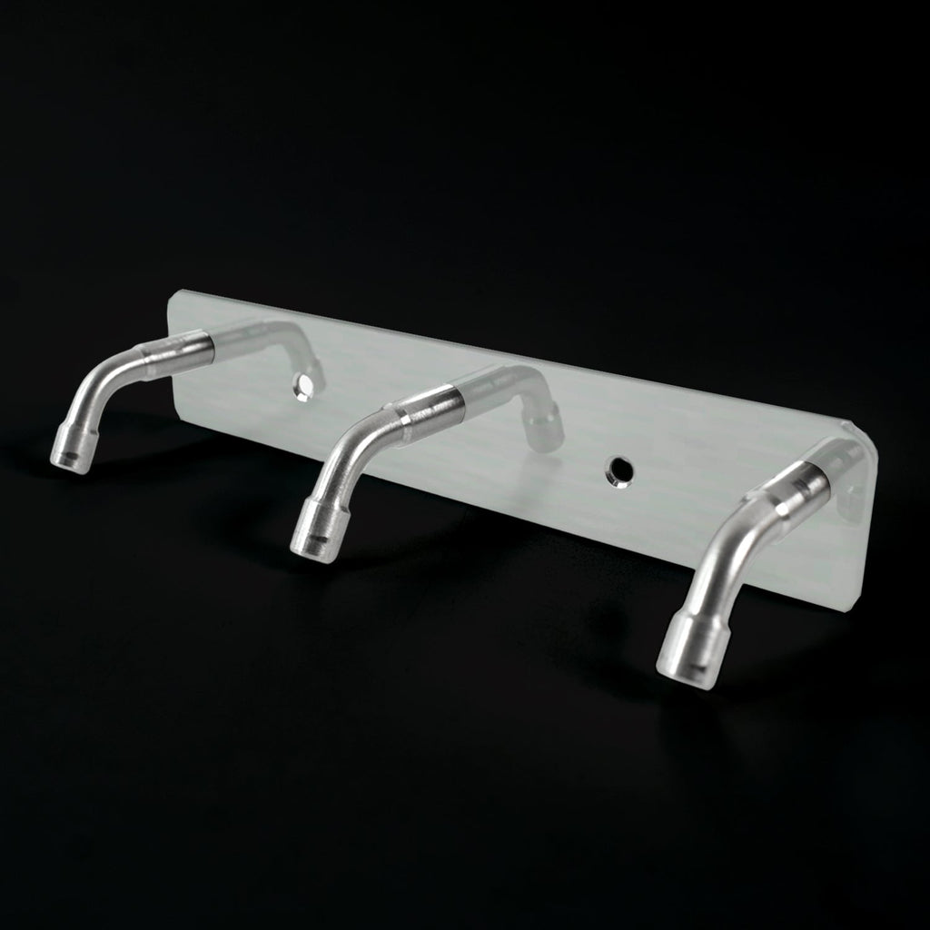 Stainless steel coat hook rack holding towels and bags
