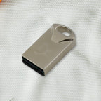 USB Car Bluetooth Adapter next to a smartphone, illustrating wireless connectivity.