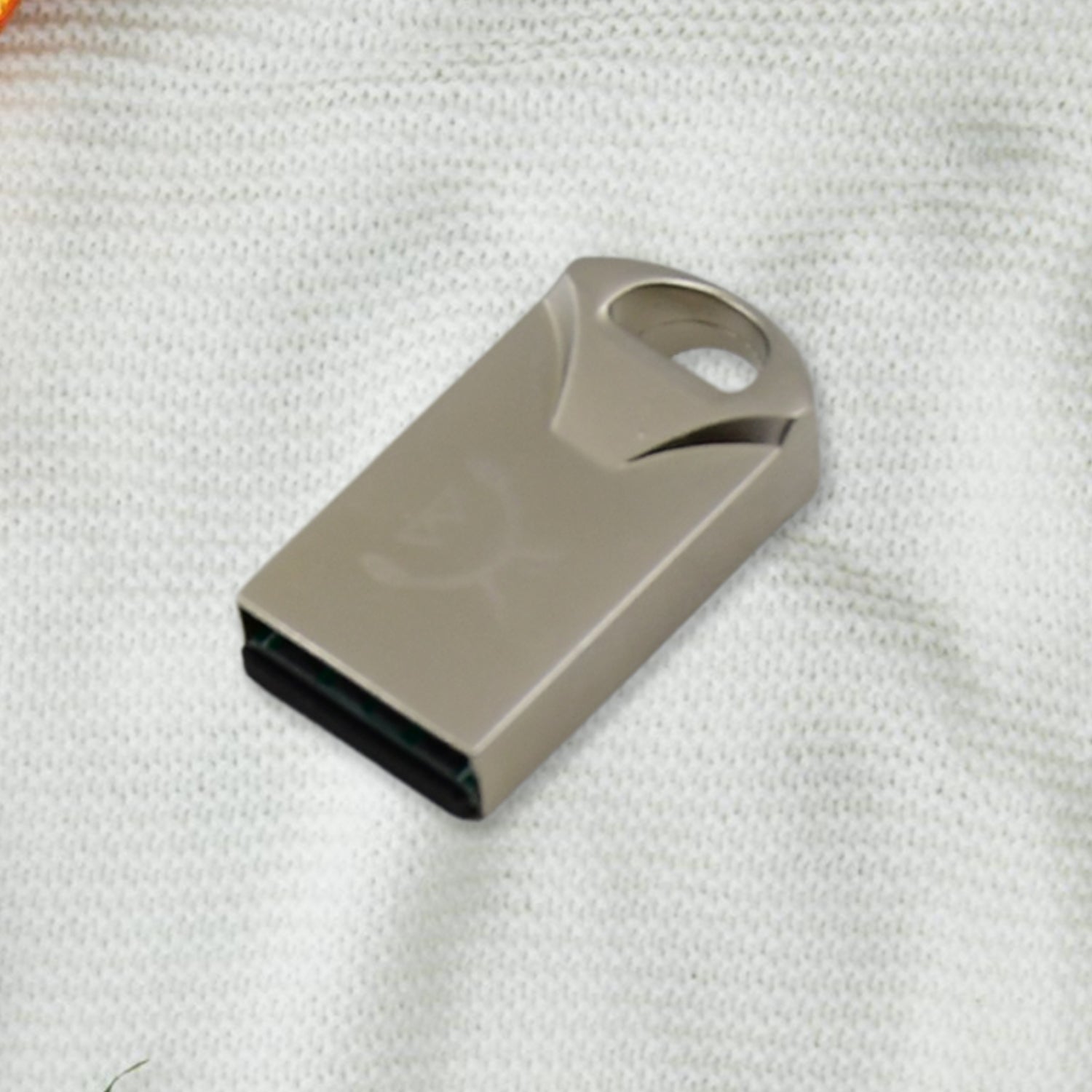 USB Car Bluetooth Adapter next to a smartphone, illustrating wireless connectivity.