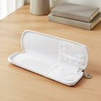 Hand holding portable zip closure makeup brush pouch