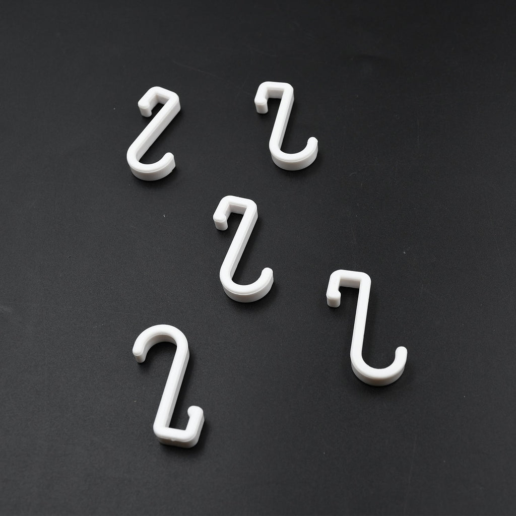 Multi-angle view of the strong self-adhesive plastic hook, highlighting its sleek design.
