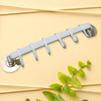 Step-by-step image demonstrating the simple, tool-free installation of the towel hanger.