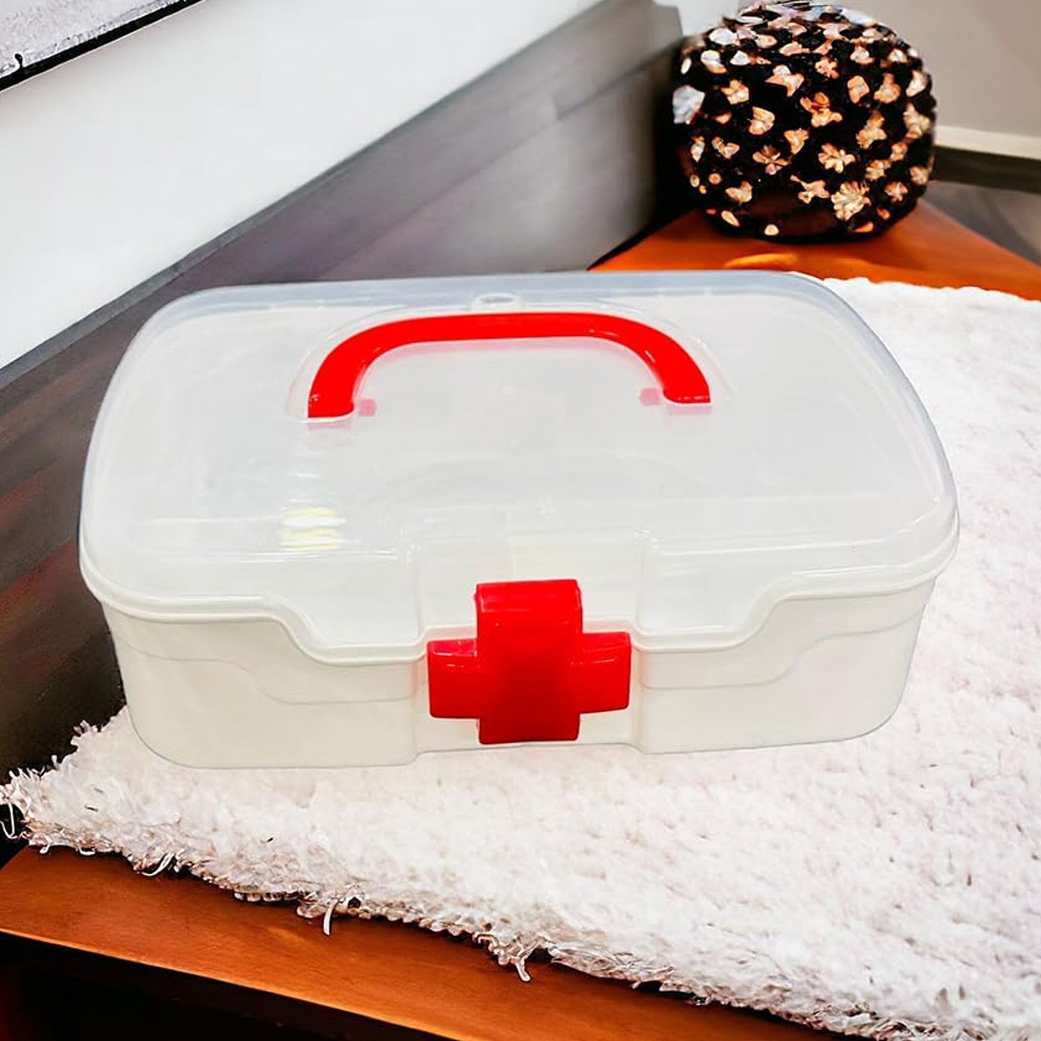 Close-up of the clear lid and internal compartments of the sturdy medicine storage box.