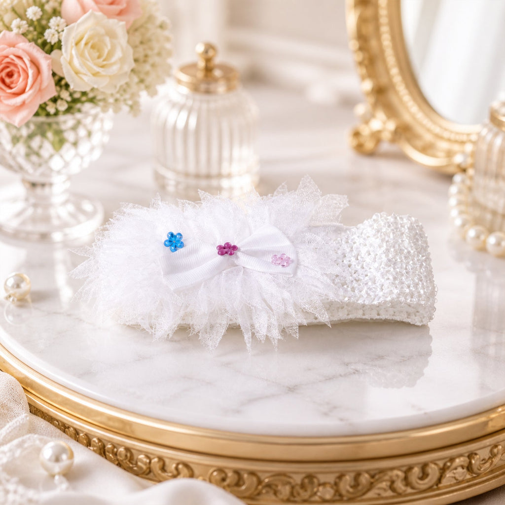 Cute baby headband with a floral bow in stretchable fabric