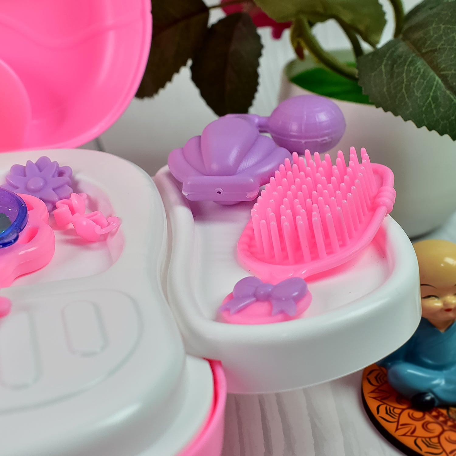 Assortment of vibrant pretend makeup accessories from the toy set.